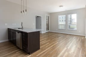 a kitchen and living room in an apartment