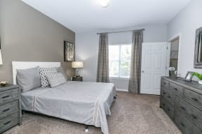 Bedroom With Expansive Windows at Villas at Hampton, Hampton