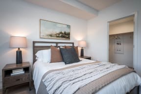 The Byway | Model #105 Beautiful Primary Bedroom Shown With Queen Sized Bed and Two Nightstands