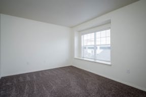 Village at Main Street | 2x2 Bedroom Two with Wall to Wall Carpeting and Light Filled Window