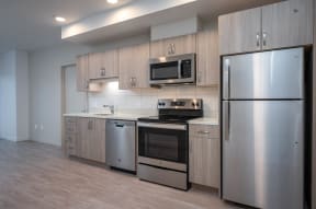 The Byway | #201 Modern Kitchen with Wood Cabinetry and Stainless Steel Appliances