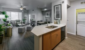 an open floor plan with a kitchen and living room