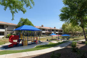 a playground at the whispering winds apartments in pearland, tx