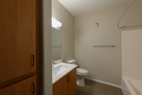a small bathroom with a toilet sink and bathtub