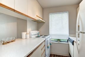 Seattle Apartments- stainless steel Kitchen- natural light- wood floors