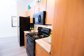 West Valley Phoenix Apartments for Rent - West Town Court Apartments - Kitchen with Quartz Counter Tops and Black Electric Appliances