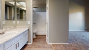 Apartments for Rent Ontario - Rancho Vista - Modern Bathroom With a Large Mirror, Medicine Cabinet, and Separate Toilet and Shower