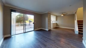 Apartments for Rent in Ontario - Rancho Vista - Unfurnished Living Room With Wood Styled Flooring, a Sliding Glass Door With a Balcony, and Natural Lighting