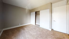 Apartments in Ontario, CA For Rent - Avante Bedroom with Wall to Wall Carpet, A Huge Closet, and Spacious Design