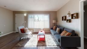 Apartments in Colton, CA - Las Brisas Apartment Living Room with Hardwood Flooring and Stylish Decor