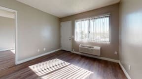 Colton CA Apartments -Las Brisas One Bedroom Apartment Living Room with Hardwood Flooring