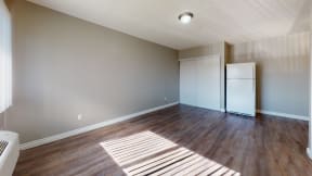Apartments for Rent in Colton - Las Brisas One Bedroom Apartment Living Room with Hardwood Flooring and Large Window