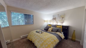 Two Bedroom Apartments in Ontario CA - Encore Apartment Homes - Bedroom with Plush Carpeting, Popcorn Ceiling, and a Window