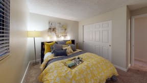 Apartments in Ontario for Rent - Encore Apartment Homes - Bedroom with Wall to Wall Carpet, A Huge Closet, and Stylish Decor