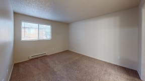 Apartments in Ontario for Rent - Encore Apartment Homes - Unfurnished Bedroom with Wall to Wall Carpet and Large Windows