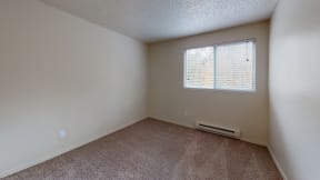 Pet Friendly Apartments in Ontario - Encore Apartment Homes - Unfurnished Bedroom with Wall to Wall Carpet and A Window