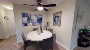 Apartments for Rent in Ontario - Encore Apartment Homes - Dining Room Nook with Plush Carpeting and a Ceiling Fan