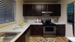 Ontario Apartments for Rent - Encore Apartment Homes - Kitchen with Stainless Steel Appliances, Wood Cabinets, and Granite Countertops