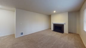 Ontario Apartments - Encore Apartment Homes - Living Room Unfurnished with Wall to Wall Carpet and A Fireplace