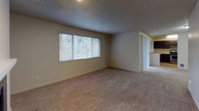Ontario Apartments - Encore Apartment Homes - Living Room Unfurnished with Wall to Wall Carpet and A Fireplace