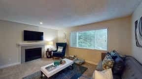 Apartments for Rent Ontario CA - Encore Apartment Homes - Spacious Living Room with Plush Carpeting, a Fireplace, and a Window