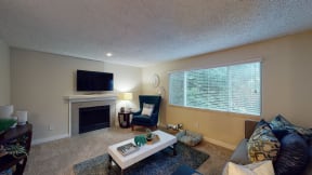 Apartments Ontario - Encore Apartment Homes -  Living Room with Wall to Wall Carpet, Wide Window, and Stylish Decor