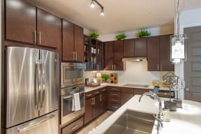 Upscale Stainless Steel Appliances at The Heights at Woodland Park Apartments, The Barvin Group, Houston, TX, 77009