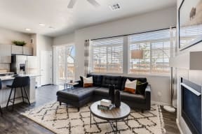 Living Room With Kitchen View at Avilla Eastlake, Colorado