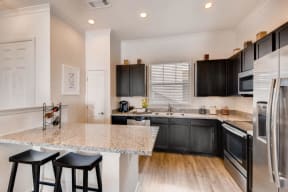 Fitted Kitchen With Island Dining at Avilla Northside, Texas, 75071