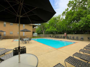 the granite at tuscany hills san antonio apartments pool deck and lounge chairs