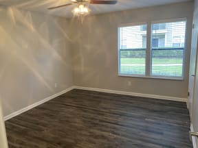 Avisa Lakes Platinum Upgrade unit bedroom with wood plank flooring