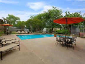 the granite at tuscany hills san antonio apartments pool lounge chairs and tables