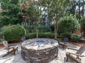 waters edge at harbison columbia apartments firepit and Adirondack chairs
