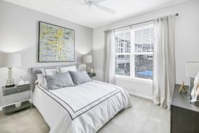 Bedroom With Expansive Windows at The Residence at Marina Bay, South Carolina