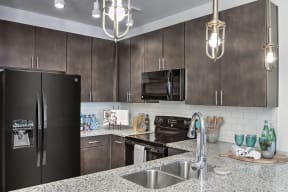 Granite Counter Tops In Kitchen at Residence at Tailrace Marina, Mount Holly, North Carolina
