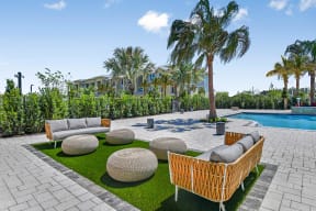 Pool Lounge Area at The Gallery Luxury Apartments in Trinity, FL