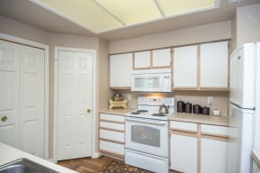 Kitchen with white appliance package | Sedona Springs
