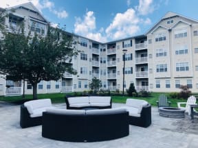 Outdoor patio with lounge seating  | Highlands at Faxon Woods