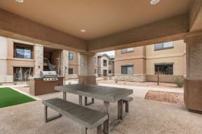 Outdoor covered patio with gas grill and picnic table | Villas at San Dorado