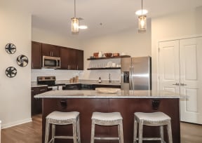 Kitchen with island seating | The Station at River Crossing