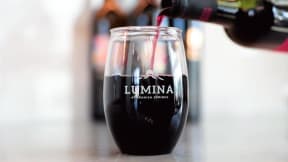 Lumina wine glass filled with red wine