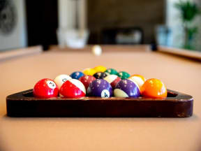close up of racked pool balls on pool table
