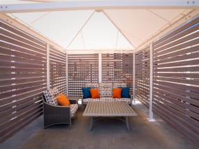 interior of pool cabana with seating and table