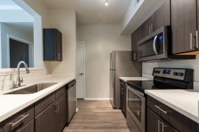 Kitchen with stainless steel appliances | River Stone Ranch
