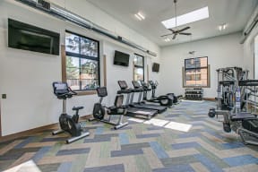 fitness center with cardio and weight equipjment