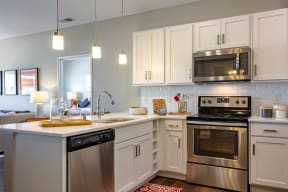 Kitchen with stainless steel appliances | SoRoc on Maine