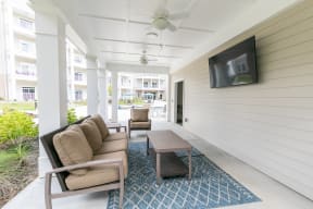 Outdoor patio with TVs | The Station at River Crossing