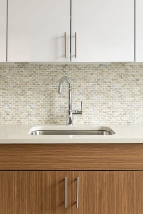 kitchen sink with tile backsplash | The Merc apartments