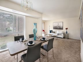 a dining room with a table and chairs