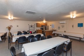Clubroom with Long, Set Tables and Full Kitchen